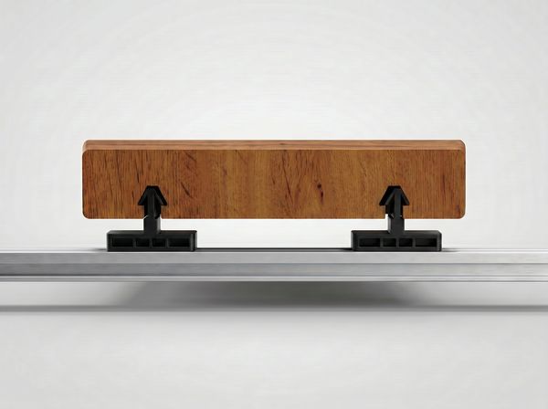InvisiClip hidden fastener clips on an aluminum rail beneath a grooved PVC deck board