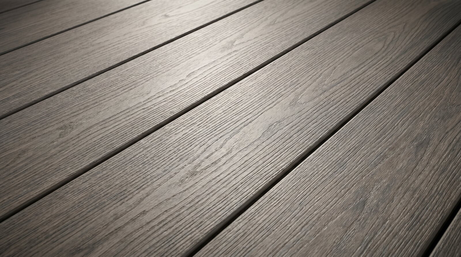 TrueGrain Deck PVC decking boards in Coastal Driftwood with deep wood grain texture
